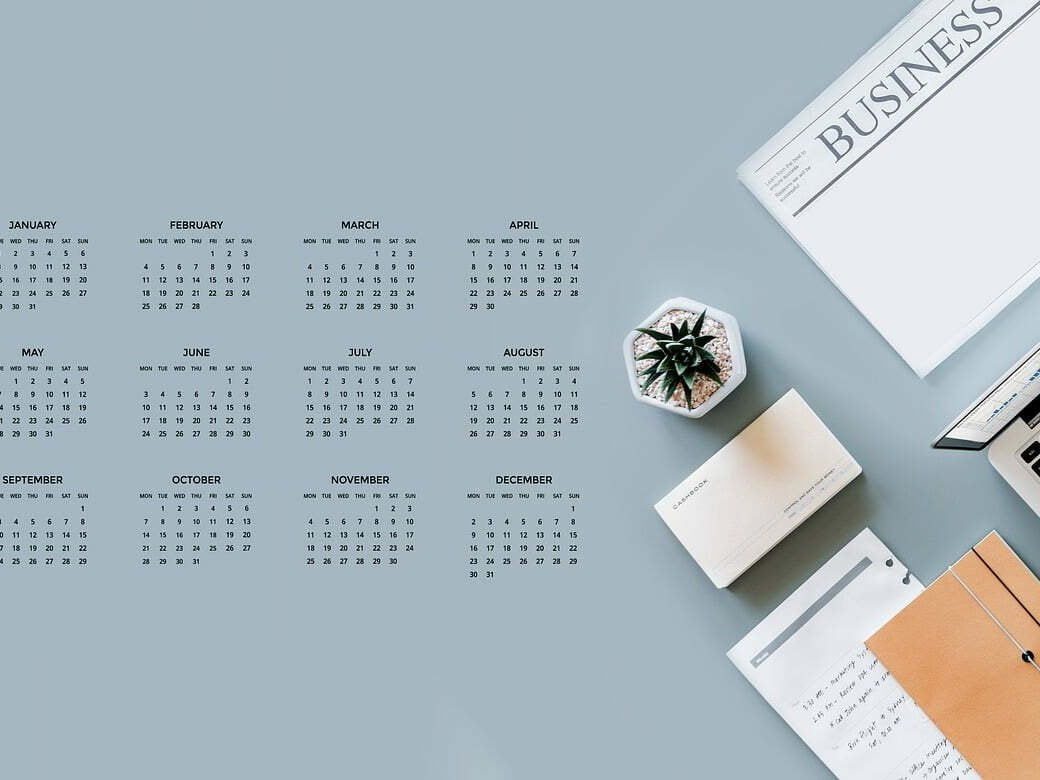 An image of a calendar, office stationery and laptop sitting on a desk. This image is related to the blog article: Do you have a digital business plan?