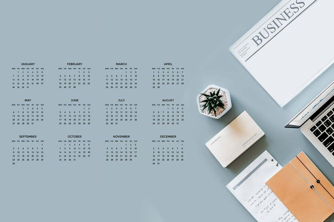 An image of a calendar, office stationery and laptop sitting on a desk. This image is related to the blog article: Do you have a digital business plan?