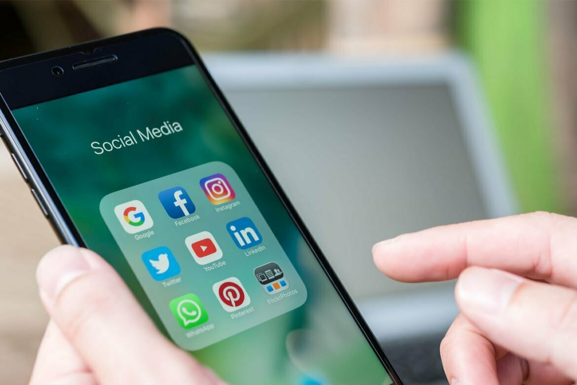 An image of a smart phone showing the user is in the Social Media menu containing nine apps which are Google, Facebook, Instagram, Twitter, Youtube, LinkedIn, WhatsApp, Pinterest, and FlickrPhotos. This is an image relating to the blog article: Five social media tips for B2B Marketers